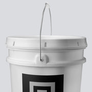 A close up of the lid of a white bucket filled with chalk