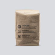 A back facing view of a brown bag of Chalk Cartel chalk.