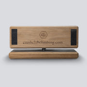 a side view of a wooden competition game that uses pinches