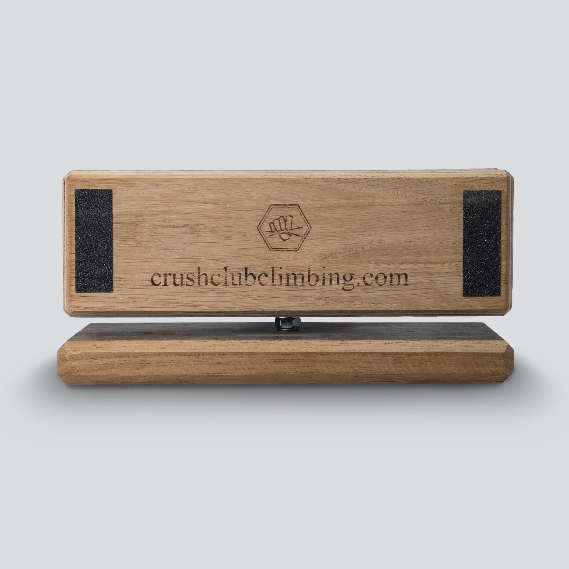 a side view of a wooden competition game that uses pinches