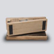 a gif of an isometric view of a wooden competition game that uses pinches where the pinch is levering back and forth