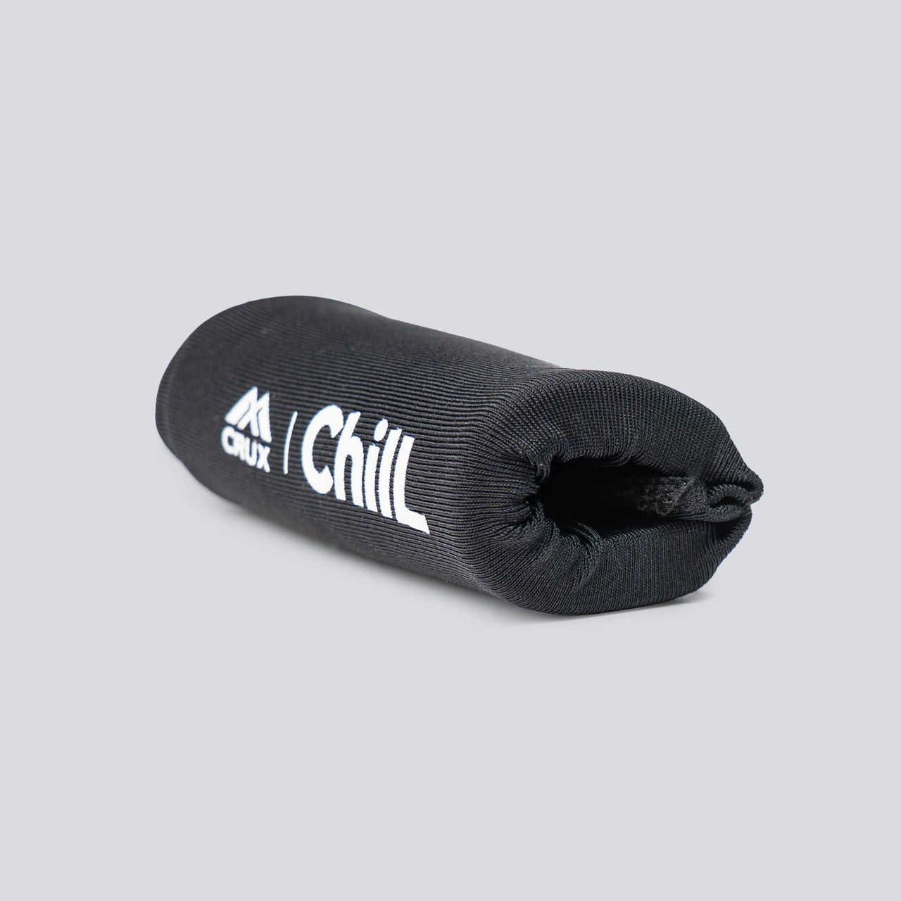 A black hot/cold finger sleeve with 'Crux' and 'Chill' text on it