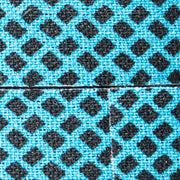 Close-up of blue and black checkered pattern fabric on tape
