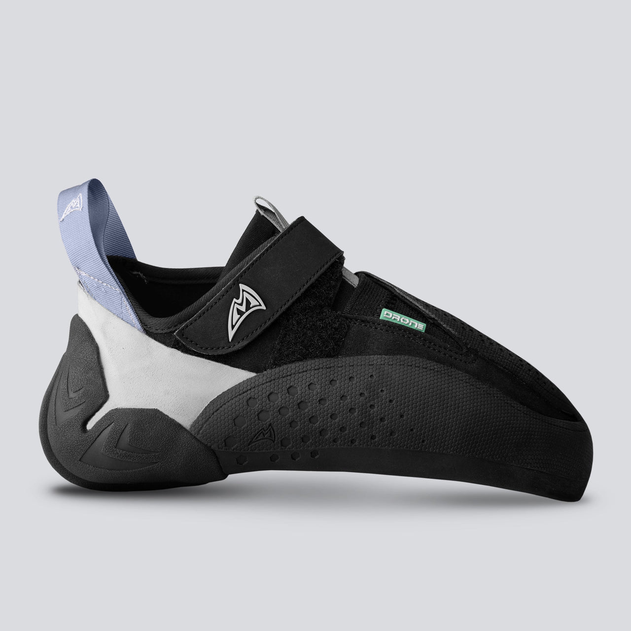 Black climbing shoe with gray and teal accents on a light gray background