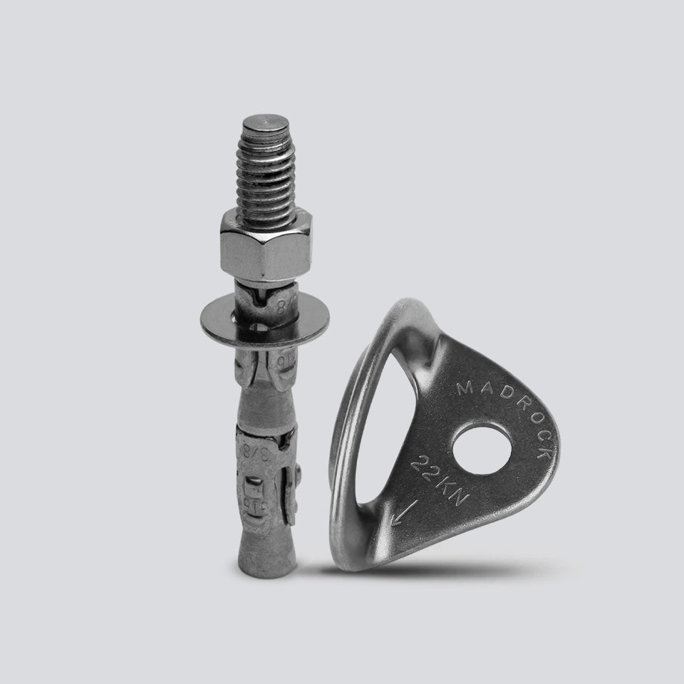 A silver metal climbing anchor bolt with a hex nut and washer, shown next to its corresponding Paladin Hanger against a light gray background.