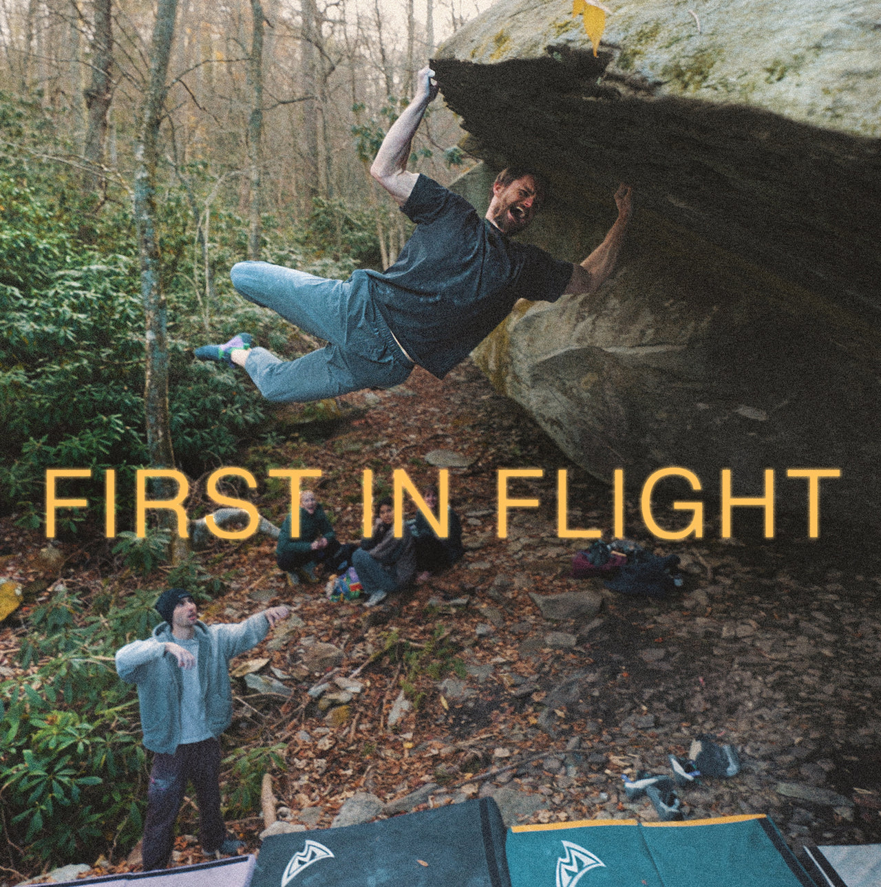 Person bouldering in a forest with 'First in Flight' text overlay