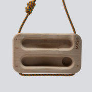 Wooden training tool with a cord on a light gray background