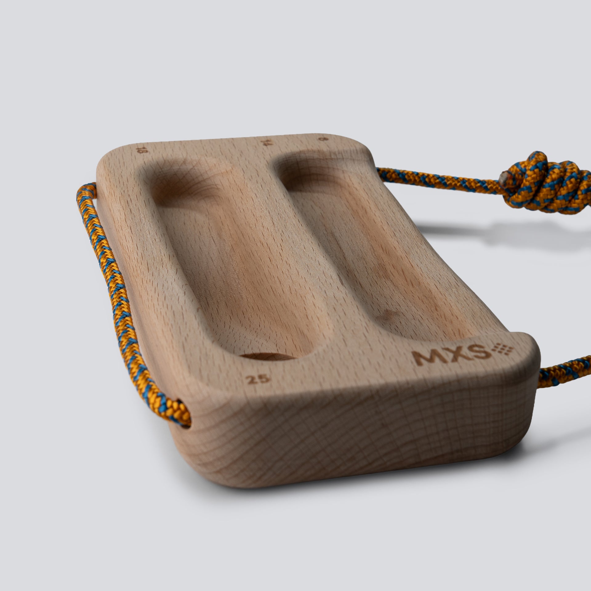Wooden training tool with a cord on a light gray background