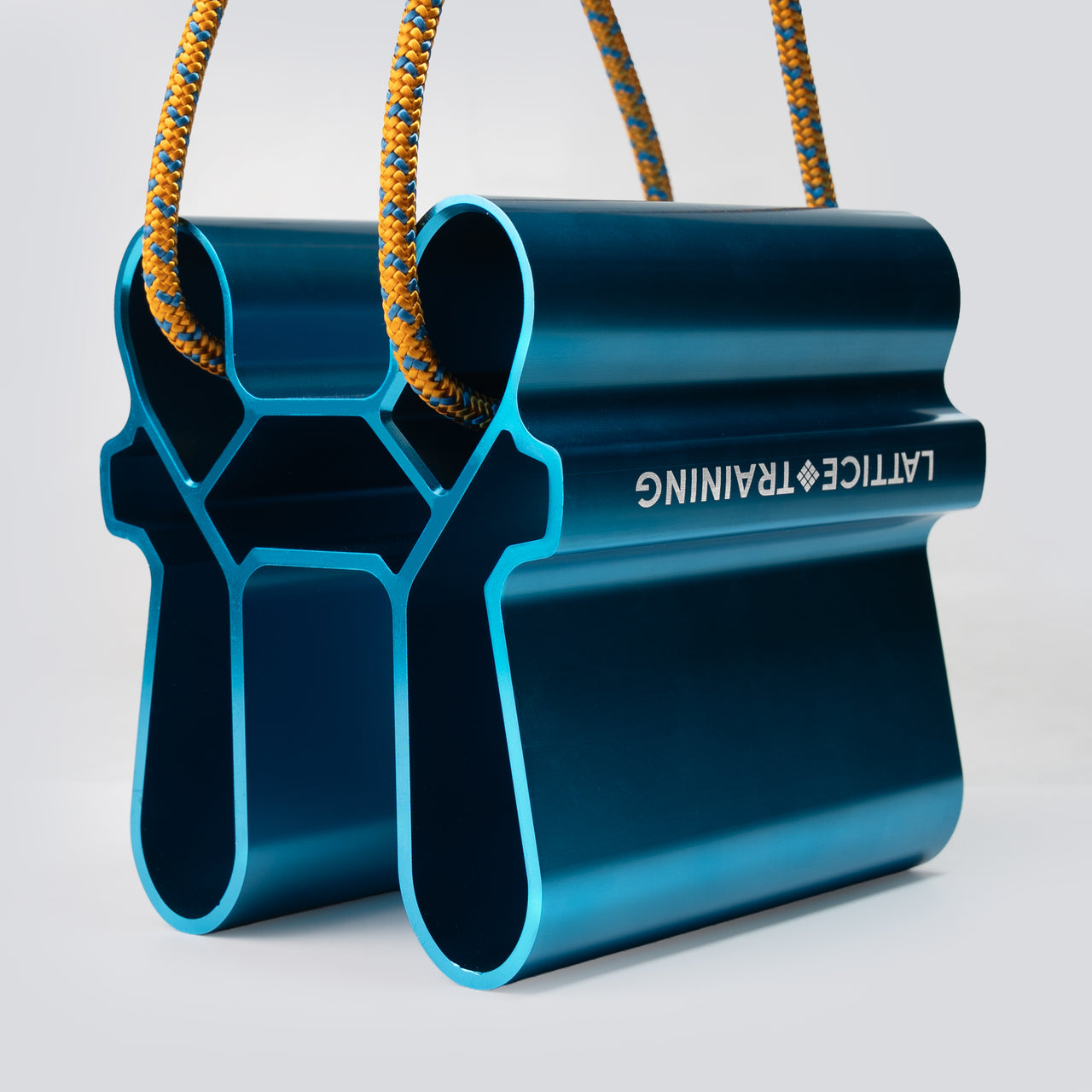 A blue metallic pinch training tool with an orange cord running through it