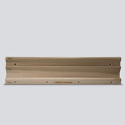 Wooden hangboard with 3 different edges on a grey background