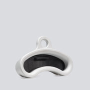 An isometric view of an aluminum finger training tool that has an ergonomic curved shape and an insert inside of it to change the edge depth.